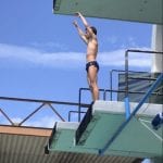Zabronsky preparing for a reverse 1-1/2 somersaults from the 5 m platform.