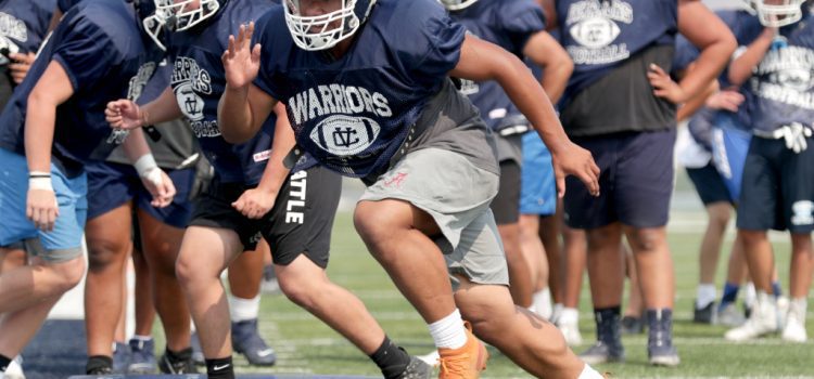 High school football players excited to get started even as COVID-19 rises