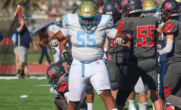 Heritage Football, Santana Roberts celebrates a tackle