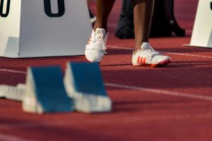 Running spikes or cleats may help performance in some track events. 